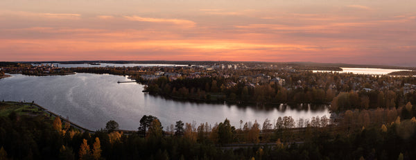 Panoramic view of lakeside town at sunset