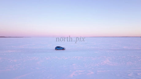 Winter Sunset Drive on a Frozen Ice Road in the Luleå Archipelago, Sweden