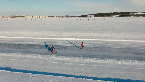 Winter fun in Luleå: Skating and biking on a frozen lake