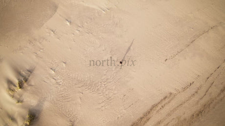Summer Day in Skvalpen Archipelago: Person Walking on Sandy Dunes in Lulea, Sweden