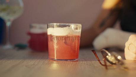 Friends Enjoying Cocktails at Sunset During Summer in the City