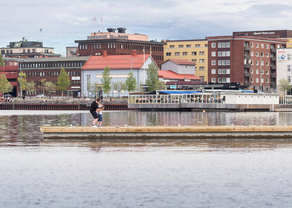 Two people on a dock in Luleå in summer