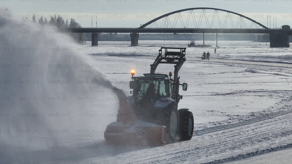 Tractor Clearing Snow on Frozen River in Lulea, Sweden, Winter Landscape