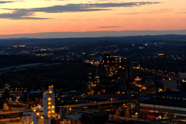 Industrial plant at sunset over Luleå city center: Nighttime Lights and industrial skyline