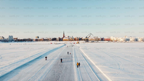 Winter day in Luleå: Drone footage of people enjoying frozen bay activities