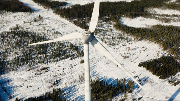 Markbygden wind farm in winter: Aerial view of a turbine in snowy landscape, Sweden