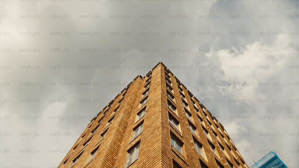 Modern wood architecture building: Rotating low angle view with cloudy sky