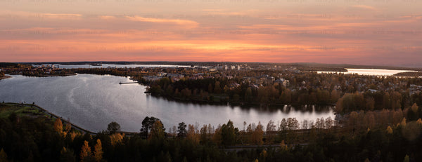Panoramic view of lakeside town at sunset