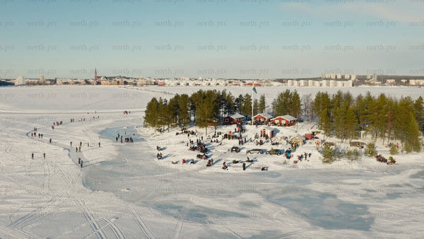 Winter wonderland in Luleå: Aerial view of frozen lake activities and scenic landscape