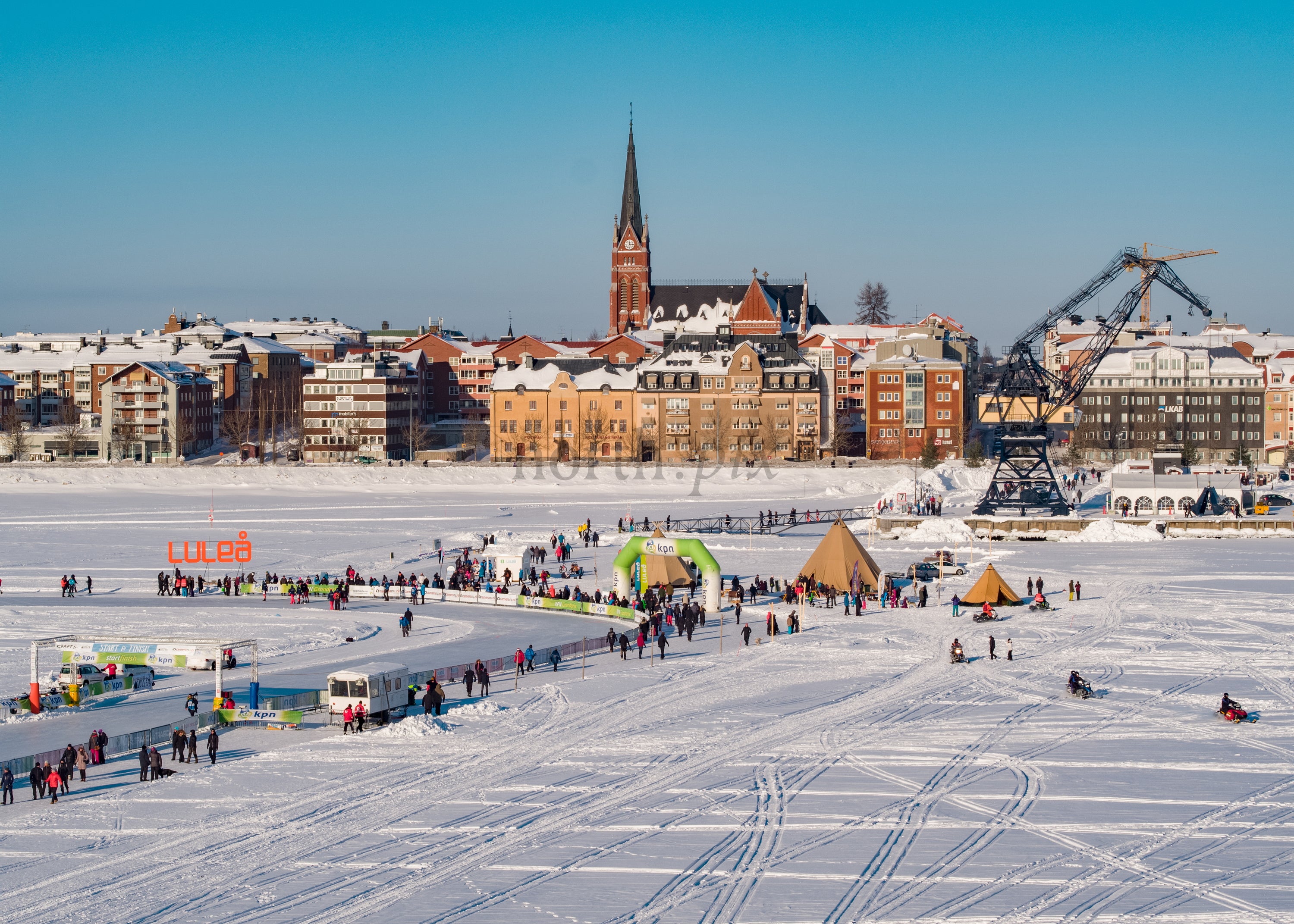 Winter Day in Luleå Sweden With Frozen Lake and Colorful Buildings