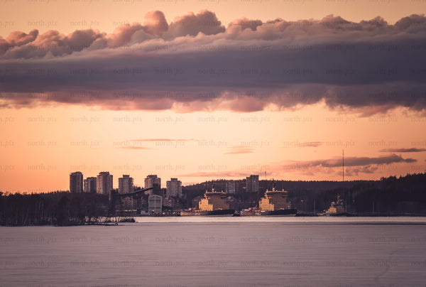 Icebreaker ships docked at harbor at sunset