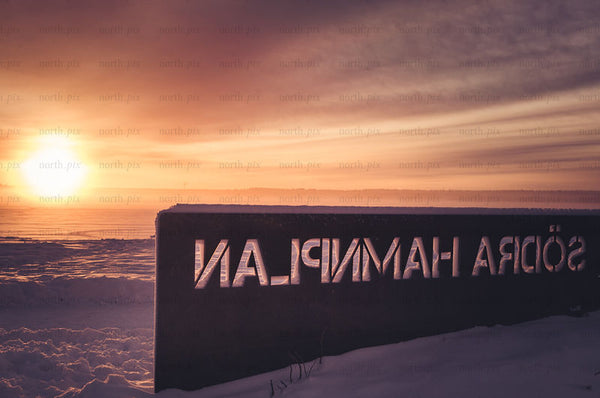 Södra Hamnplan waterfront sign at sunrise, winter