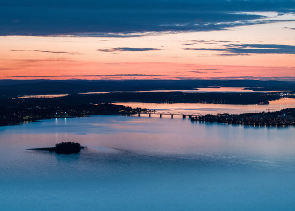 Aerial twilight view of Luleå's Bergnäsbron bridge and surrounding waterscape