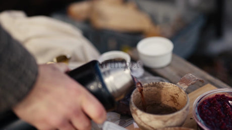 Winter Picnic in the Luleå Archipelago: Pouring a Hot Drink into a Kuksa Mug
