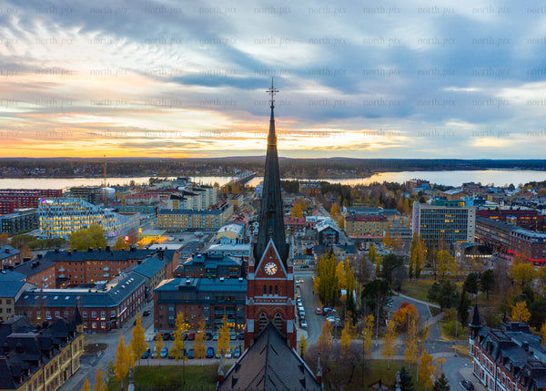 Aerial view of Luleå in autumn during sunset with church as focal point