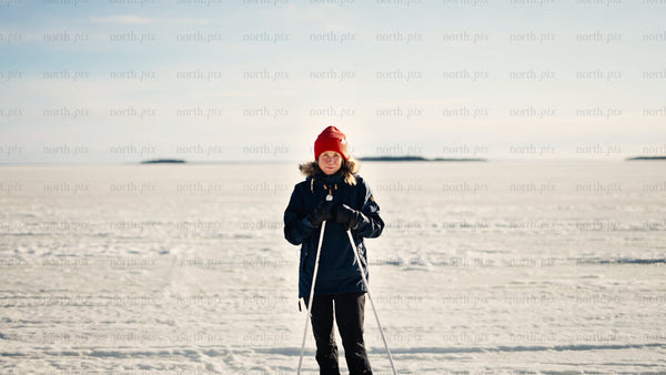 Winter cross-country skiing in Luleå archipelago: Woman enjoys scenic frozen landscape