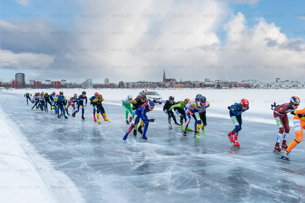 KPN speed skaters racing on natural ice near city