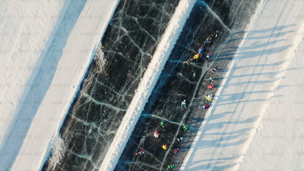 Winter Ice Skating in Luleå, Sweden: Aerial Drone View of People on a Frozen Track