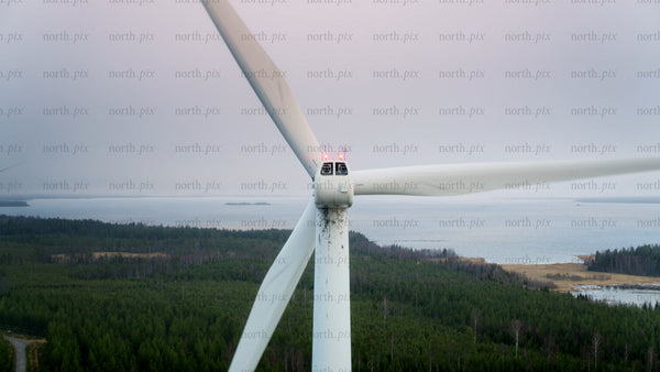 Wind turbine spinning: Clean energy in a scenic landscape