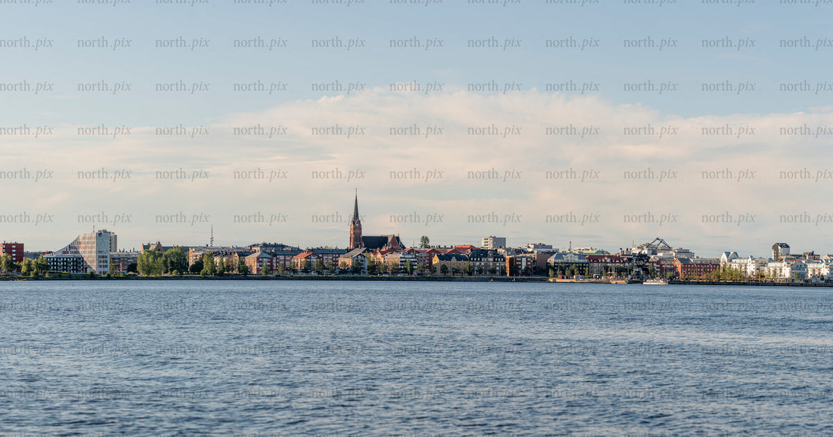 Panoramic waterfront city skyline in summer afternoon