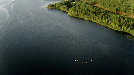Kayakers on a Summer Day in Luleå, Sweden: A Drone's Eye View of Tranquil Lake and Forest
