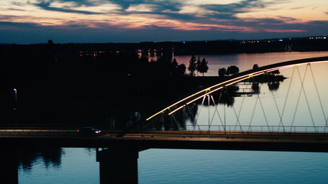 Aerial Sunset View of Car on Bergnäsbron Bridge in Luleå, Sweden