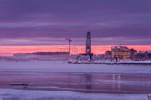 Industrial crane at Luleå waterfront at sunrise