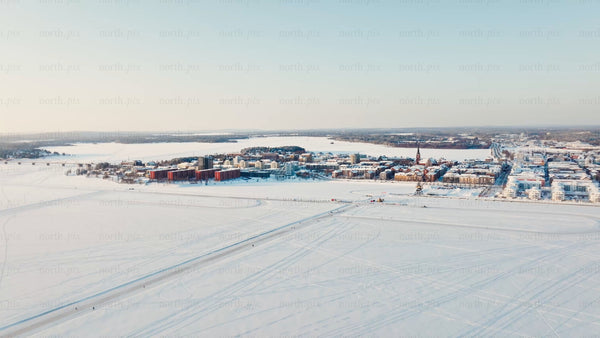 Winter in Luleå: Aerial drone view of frozen river and city center