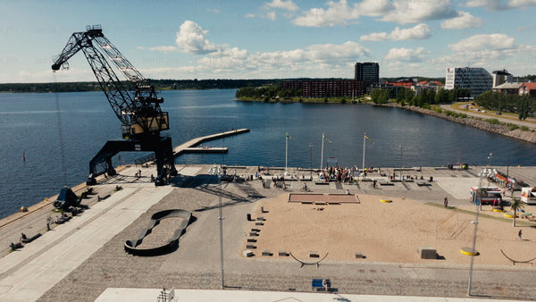 Summer in Luleå: Aerial view of harbor, cityscape, and beach activity