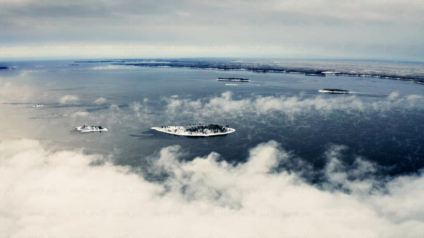 View of Piteå Haraholmen archipelago in winter with snowy islands and icy waters