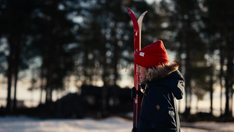 Winter Day in Luleå: Person Walks Across Snowy Landscape with Skis
