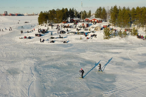 Winter fun at Luleå city center: Skaters and snowy gatherings on a frozen lake