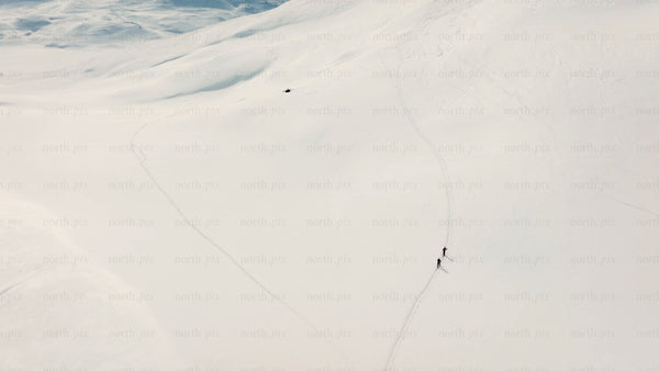 Skiers on snowy mountain slope in riksgransen, Sweden