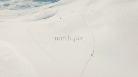 Skiers on Snowy Mountain Slope in Riksgransen, Sweden