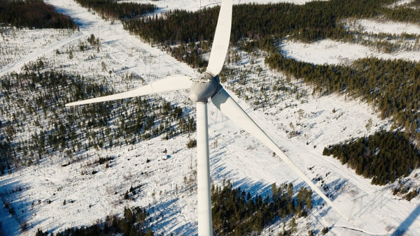 Markbygden wind farm in winter: Aerial view of a turbine in snowy landscape, Sweden