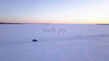 Driving on Frozen Ice Road in Lövskär Archipelago at Sunset
