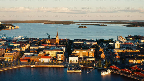Luleå: A summer sunset aerial view of the city's waterfront and church