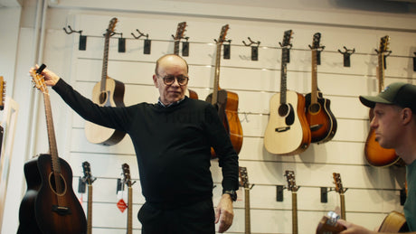 Guitar Shopping Experience: Customer and Employee Discuss Acoustic Guitars in Music Store