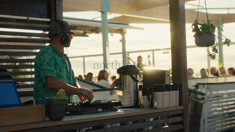 DJ Playing Music at Rooftop Bar in Lulea, Sweden at Sunset