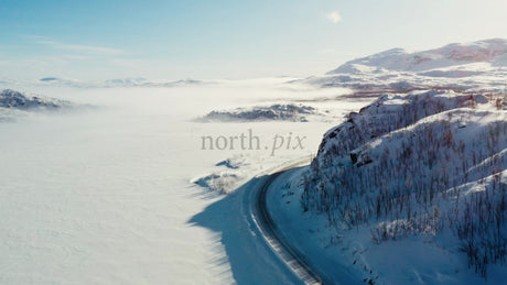 Aerial Drone View of Snowy Road in Riksgränsen Mountains