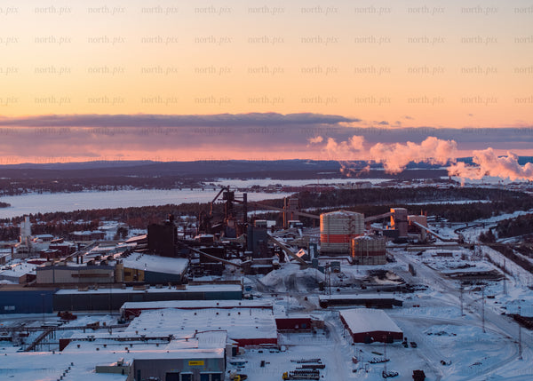 Industrial landscape in winter during sunset viewed by drone