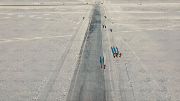 Aerial view of ice road on frozen lake near Luleå in winter
