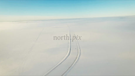 Snowmobile on Ice Road in Lulea Archipelago, Winter Day