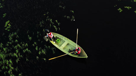 Crayfish Fishing From a Boat on a Calm Summer Lake in Luleå, Sweden