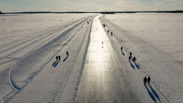 Ice skating and walking on a frozen lake in Luleå, on a winter day