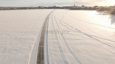 Winter Wonderland in Lulea: Aerial View of Frozen Lake Activities