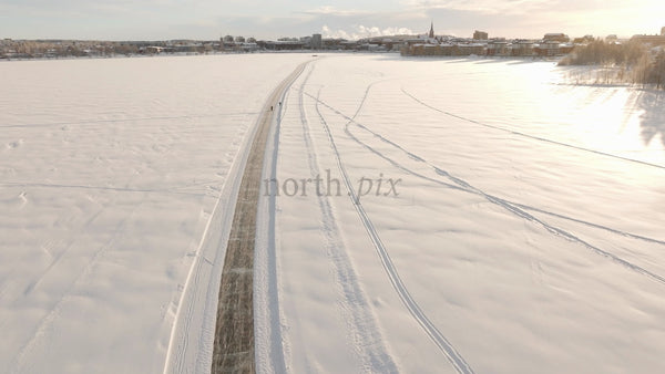 Winter Wonderland in Lulea: Aerial View of Frozen Lake Activities