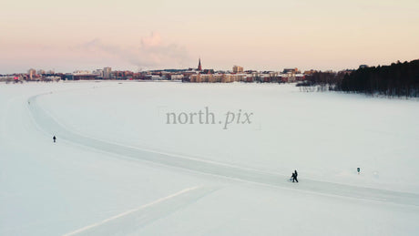 Winter Wonderland in Lulea: Skiing on a Frozen Lake at Sunset