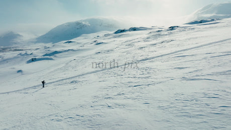Solo Skier in Snowy Mountains of Riksgränsen, Sweden