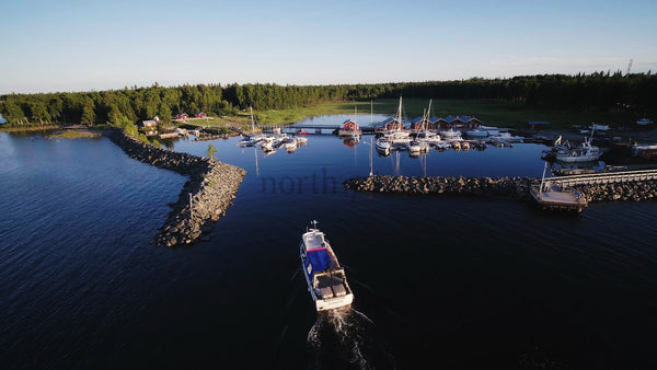 Summer Day in Junkön Archipelago: Boat Navigating Luleå Harbor, Sweden